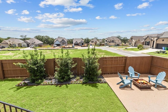 view of yard with a patio area and an outdoor fire pit