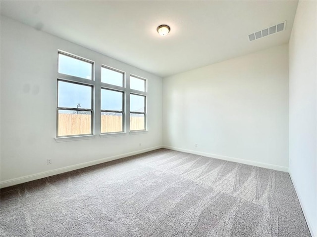 unfurnished room with carpet flooring