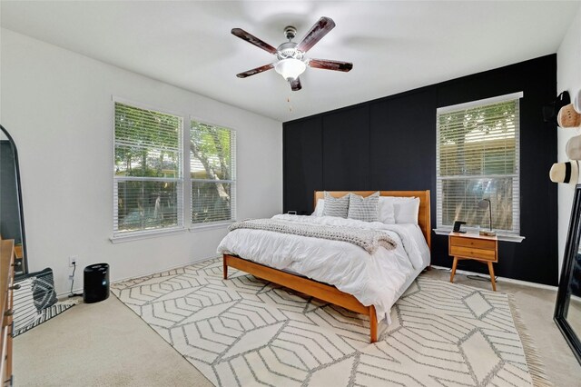 carpeted bedroom featuring ceiling fan