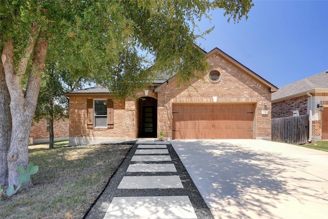 ranch-style home featuring a garage