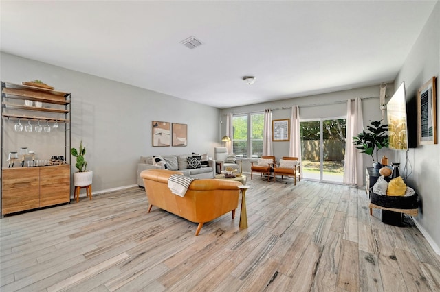 living room with light hardwood / wood-style flooring