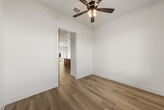 unfurnished room featuring ceiling fan and light hardwood / wood-style floors