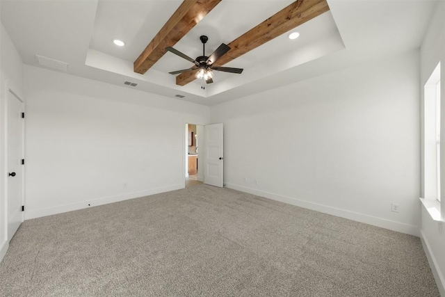 unfurnished bedroom featuring carpet, a raised ceiling, ceiling fan, and beamed ceiling