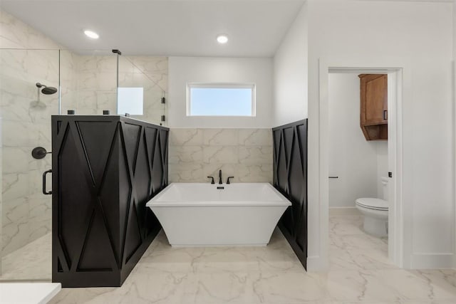 bathroom featuring shower with separate bathtub and toilet