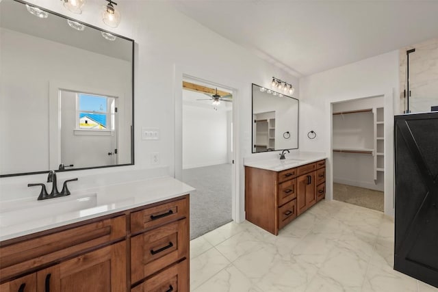 bathroom featuring ceiling fan and vanity