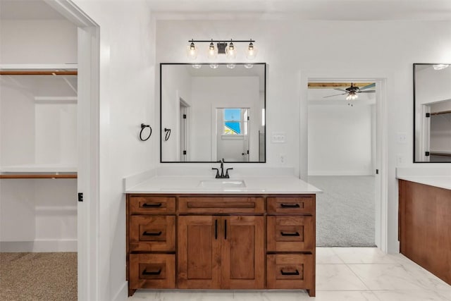 bathroom featuring ceiling fan and vanity