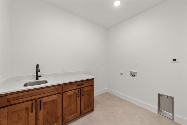 laundry area with electric dryer hookup, cabinets, gas dryer hookup, sink, and washer hookup