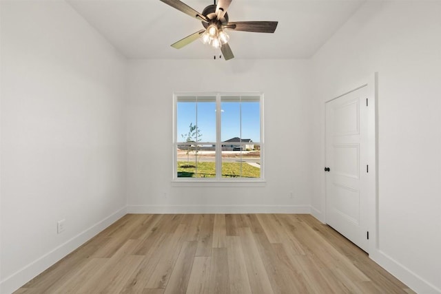 spare room featuring ceiling fan and light wood-type flooring