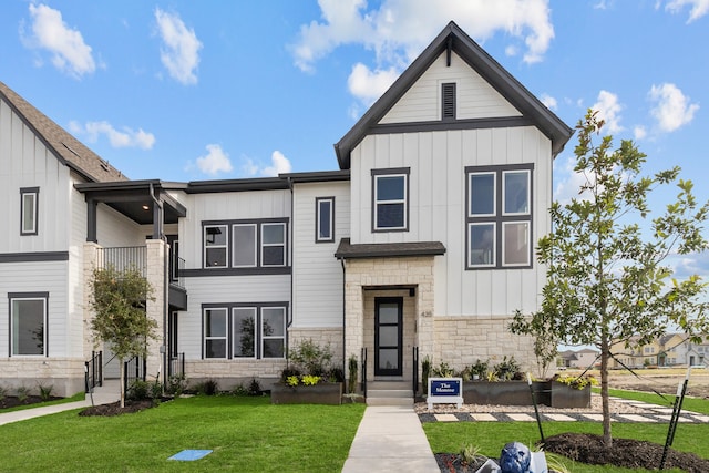 modern inspired farmhouse with a front yard