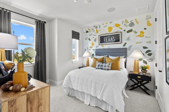 bedroom featuring light colored carpet