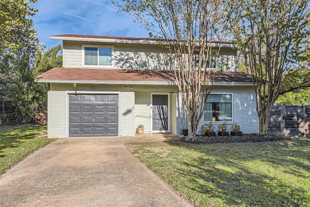 view of front of house with a front lawn and a garage