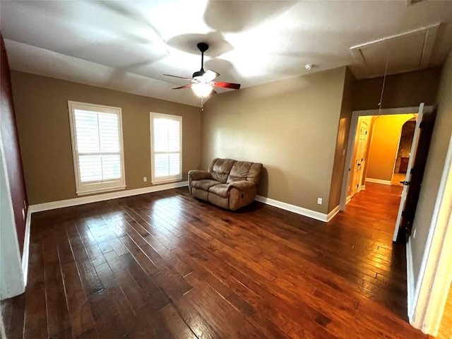 unfurnished room with dark hardwood / wood-style flooring and ceiling fan