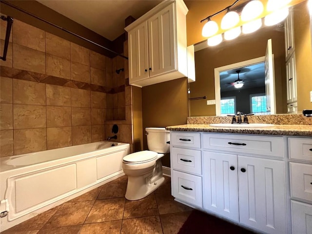 full bathroom with vanity, bathing tub / shower combination, tile patterned flooring, ceiling fan, and toilet