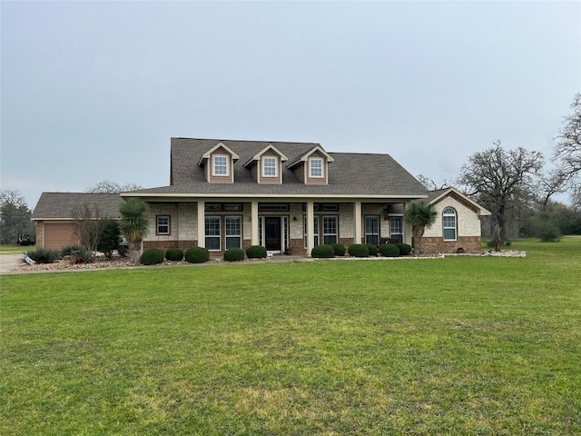 view of front of property with a porch and a front yard