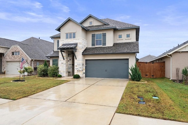 view of front of house featuring a front yard and a garage