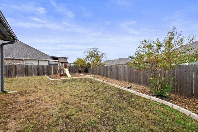 view of yard with a playground