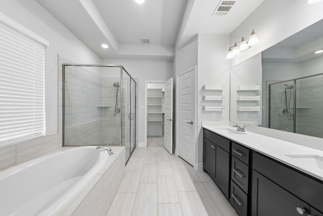 bathroom with vanity and plus walk in shower