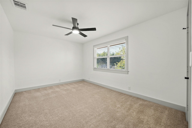 empty room with light carpet and ceiling fan