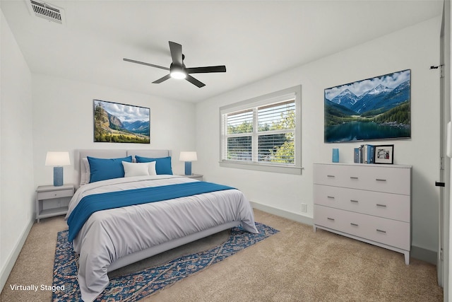 carpeted bedroom with ceiling fan