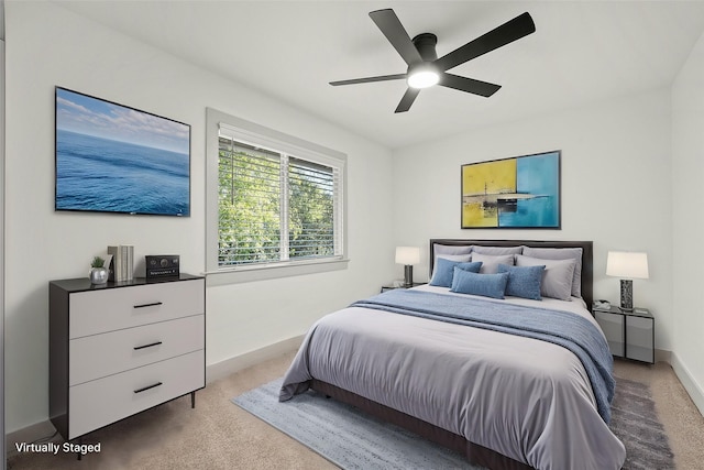 carpeted bedroom with ceiling fan