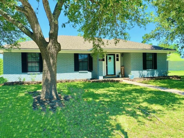 ranch-style home with a front yard