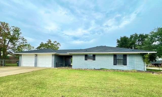 ranch-style home with a front yard and a garage