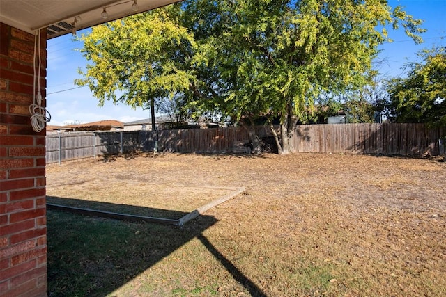 view of yard with a fenced backyard