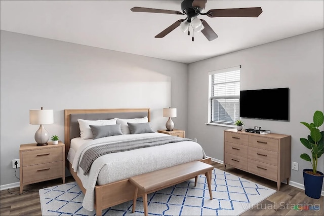 bedroom with light wood-style flooring, a ceiling fan, and baseboards