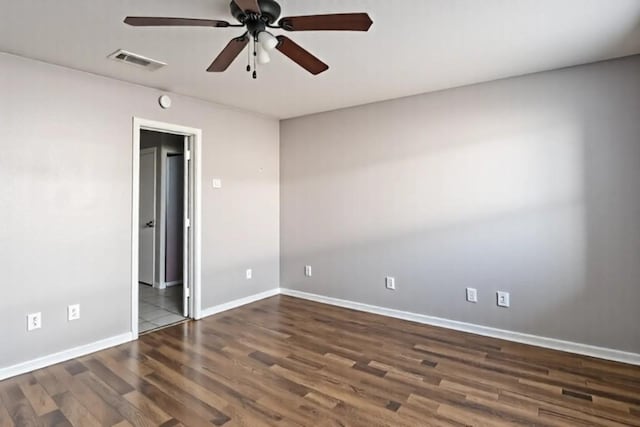 unfurnished bedroom with wood finished floors, visible vents, a ceiling fan, and baseboards