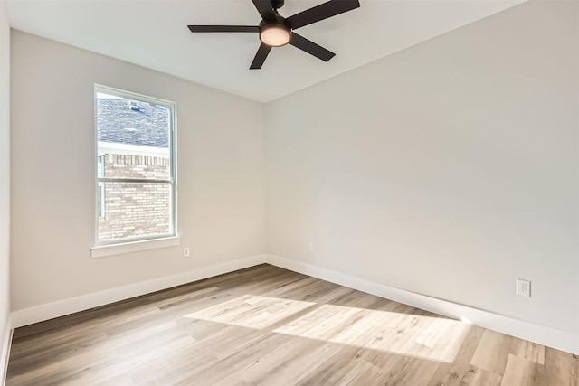 empty room with ceiling fan and light hardwood / wood-style floors