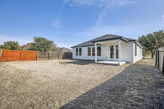 rear view of property with a patio and french doors