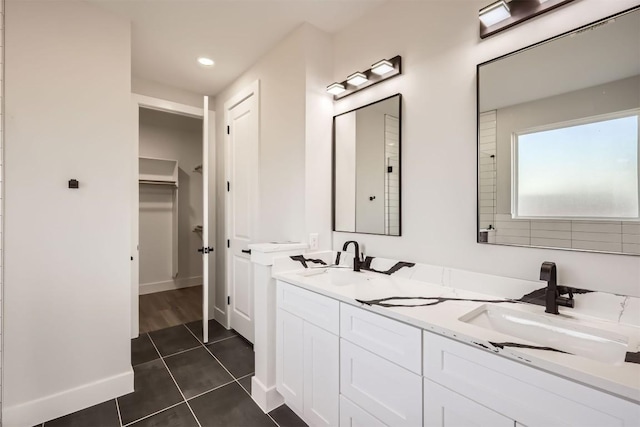 bathroom with tile patterned flooring and vanity