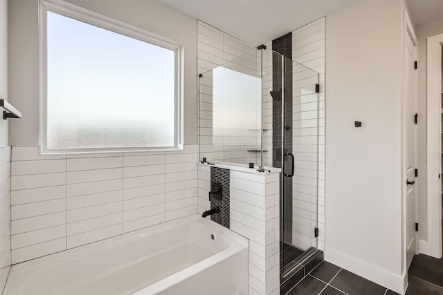 bathroom featuring tile patterned flooring and plus walk in shower