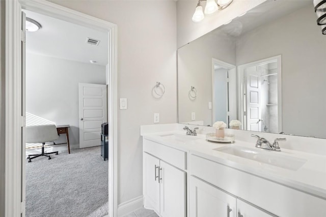 120 Krupp Ave, Liberty Hill, TX 78642 - bathroom featuring double vanity, baseboards, and a shower