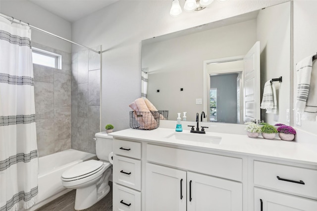 full bathroom with toilet, vanity, wood-type flooring, and shower / bathtub combination with curtain