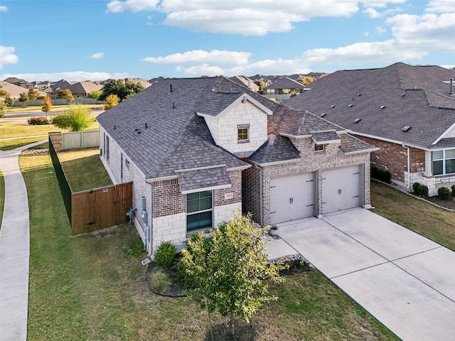 view of front of home with a garage and a front yard