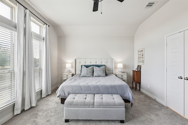 carpeted bedroom featuring ceiling fan and lofted ceiling