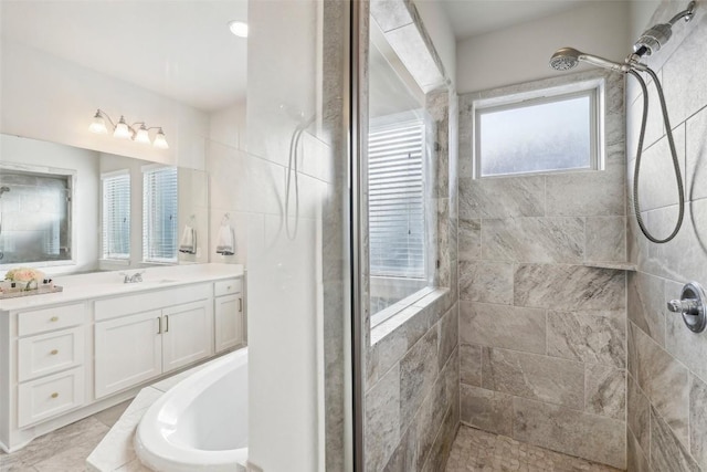 120 Krupp Ave, Liberty Hill, TX 78642 - bathroom featuring tiled shower, vanity, and a bath