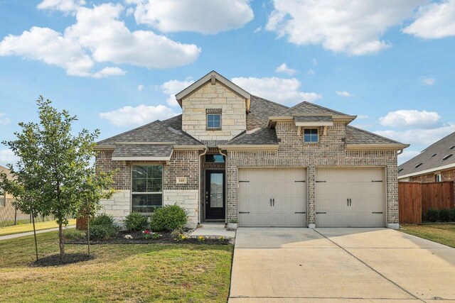 120 Krupp Ave, Liberty Hill, TX 78642 - french country home featuring concrete driveway, stone siding, brick siding, a garage, and a shingled roof