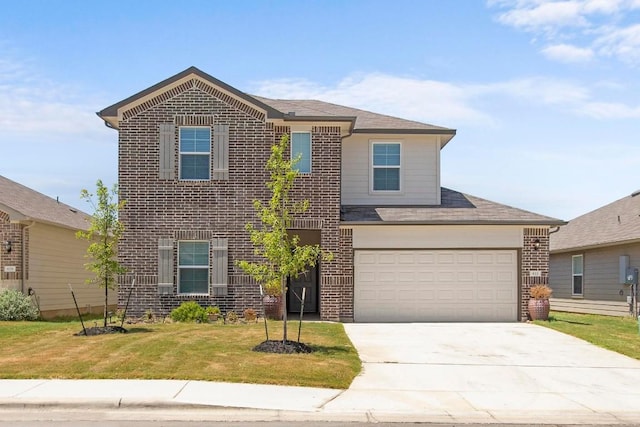 view of front of property featuring a garage and a front lawn