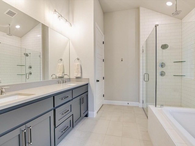 bathroom featuring tile patterned floors, vanity, separate shower and tub, and vaulted ceiling