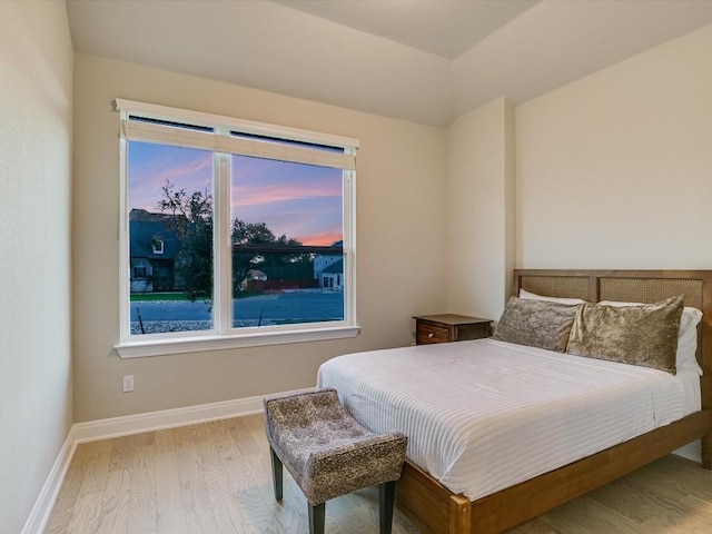 bedroom with light wood-type flooring