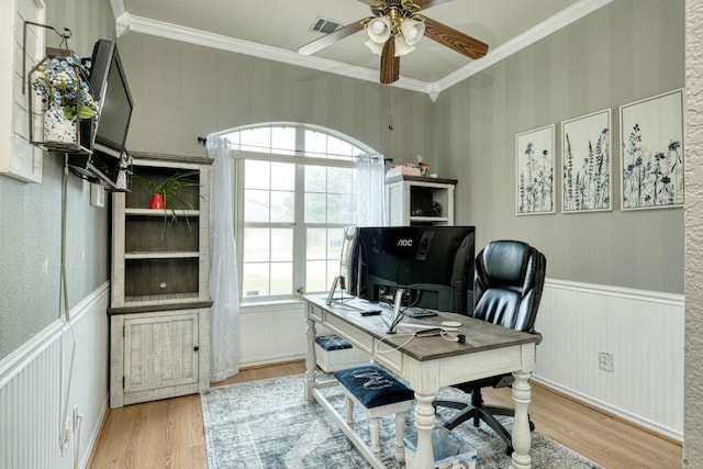 office area with ceiling fan, light wood-type flooring, and ornamental molding