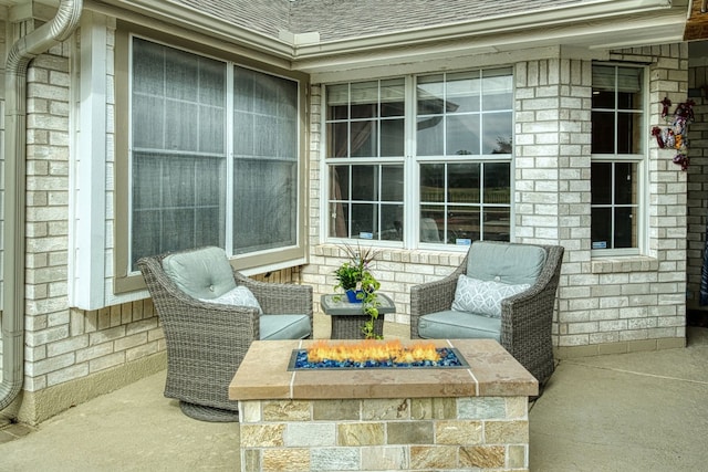 view of patio with a fire pit