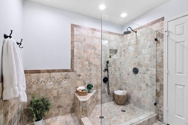 bathroom with tiled shower