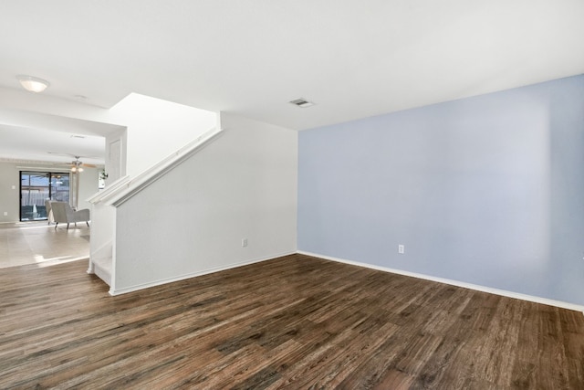 unfurnished living room with hardwood / wood-style floors and ceiling fan