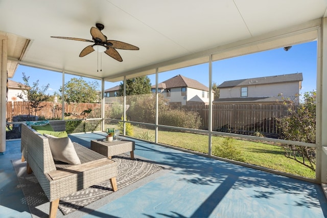 sunroom with ceiling fan