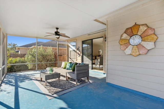 unfurnished sunroom with ceiling fan