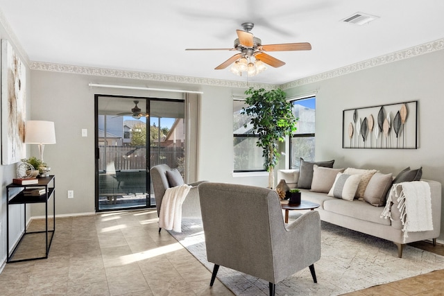 tiled living room with ceiling fan and a healthy amount of sunlight