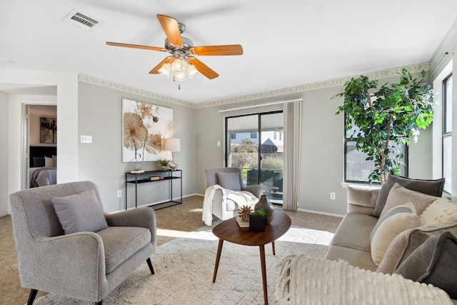 living room featuring light carpet and ceiling fan